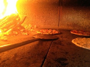 The wood stone floor is kept at 750 degrees. The beauty of a wood-fired oven at that the temperature ensures the crust will not be soggy and the radiated heat cooks the top ingredients quickly.